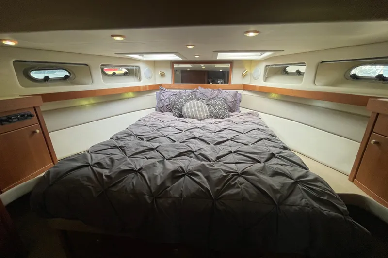 Slide: The Image of Luxurious bedroom interior of 1995 Bayliner 4788 Pilot House Motoryacht with cozy bedding. - 30