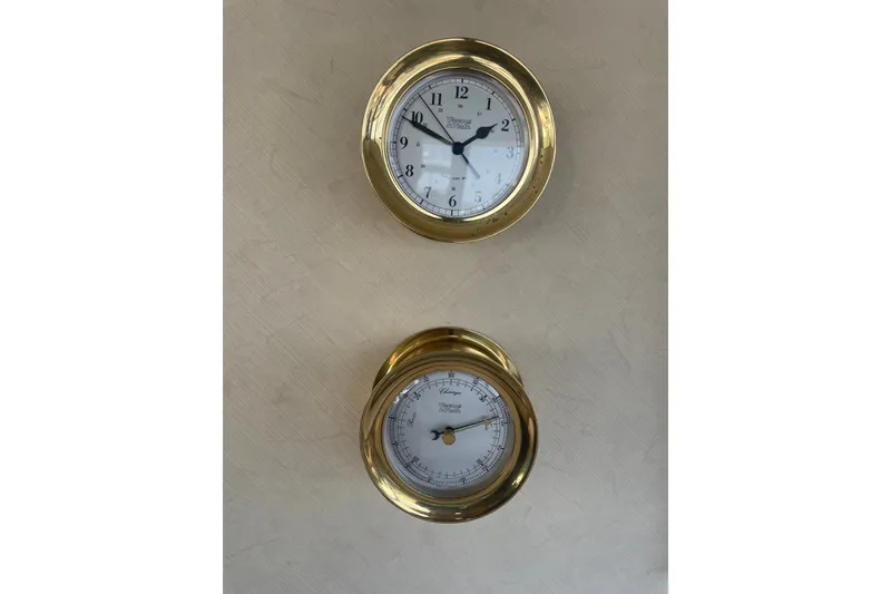 Slide: The Image of Brass clock and barometer on 1995 Bayliner 4788 Pilot House Motoryacht interior wall. - 18