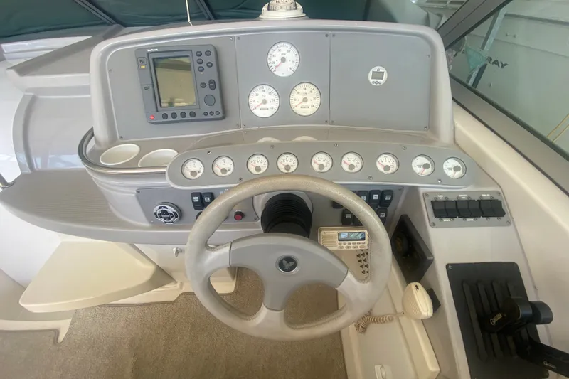 Slide: The Image of Cockpit of a 2001 Formula 370 Super Sport boat with steering wheel and instrument panel. - 19