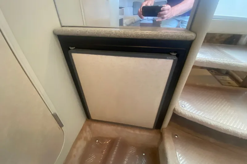 Slide: The Image of Interior of 2001 Formula 370 Super Sport with compact fridge and carpeted stairs. - 36