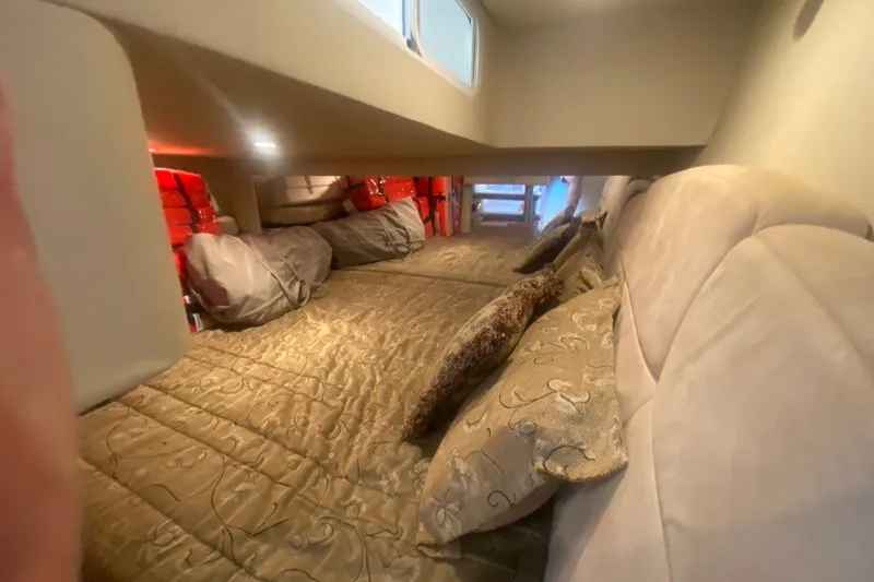 Slide: The Image of Luxurious cabin interior of 2001 Formula 370 Super Sport with plush bedding and cushions. - 38
