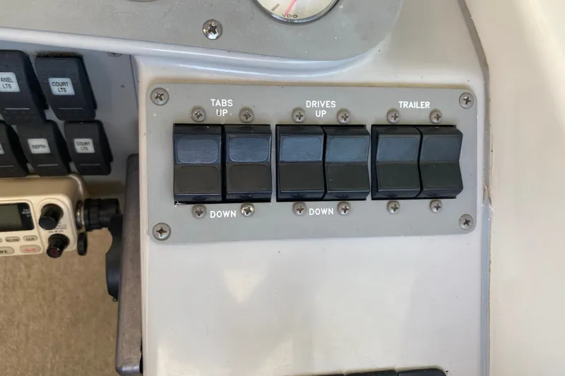 Slide: The Image of Control panel of a 2001 Formula 370 Super Sport boat with labeled switches. - 23
