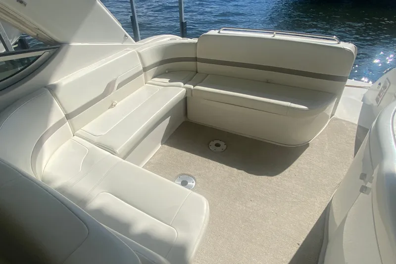 Slide: The Image of Interior of 2001 Formula 370 Super Sport boat with beige seating and carpet. - 16