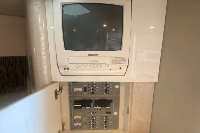 Slide: The Image of 2001 Formula 370 Super Sport cabin with vintage Panasonic TV and control panel. - 30