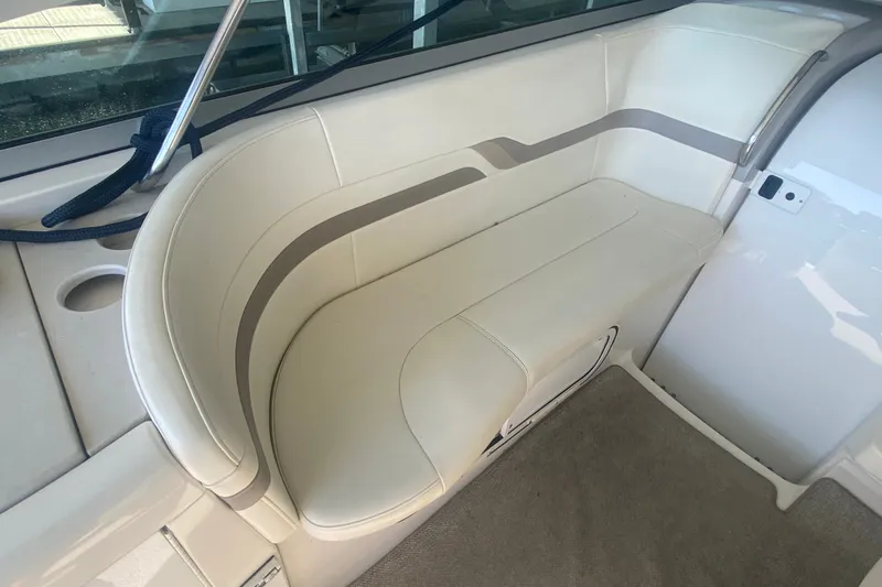 Slide: The Image of Interior seating of a 2001 Formula 370 Super Sport boat, featuring beige upholstery. - 17