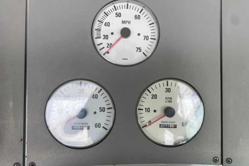 Slide: The Image of Dashboard gauges of a 2001 Formula 370 Super Sport boat, showing speed and engine hours. - 20