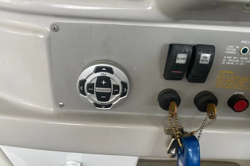 Slide: The Image of Control panel of a 2001 Formula 370 Super Sport boat with Kenwood audio controls. - 25