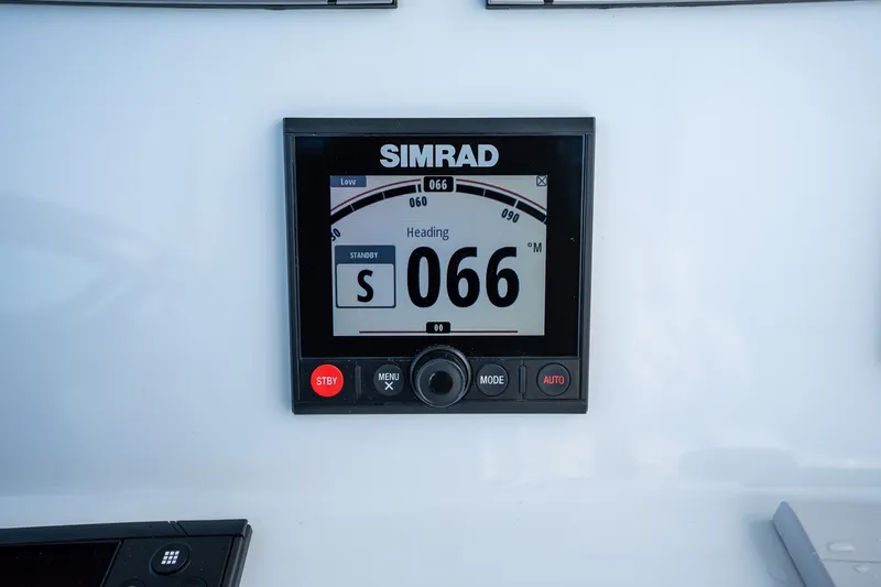 Slide: The Image of Simrad navigation display on 2021 Yellowfin 36 Offshore boat, showing heading 066. - 21