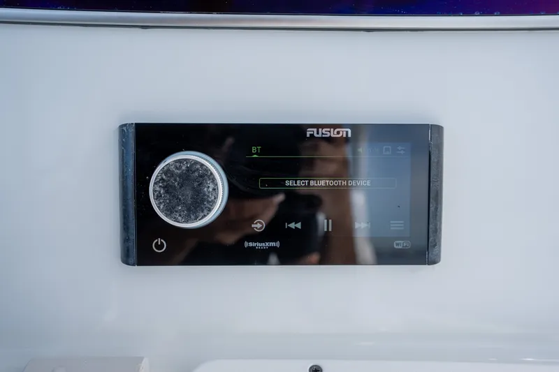 Slide: The Image of Fusion audio system on 2021 Yellowfin 36 Offshore boat, displaying Bluetooth device selection. - 22