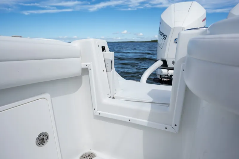 Slide: The Image of 2021 Yellowfin 36 Offshore boat with outboard motor on open water. - 19
