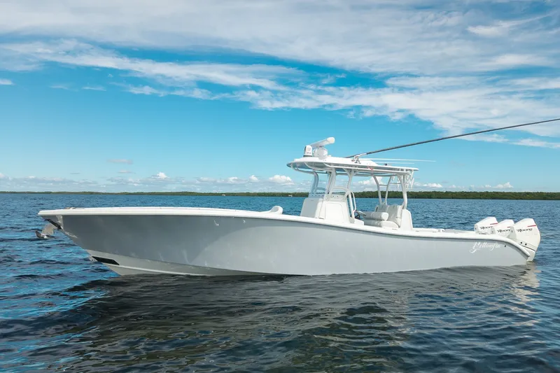 The Image of 2021 Yellowfin 36 Offshore boat on calm water under a clear blue sky. - 0