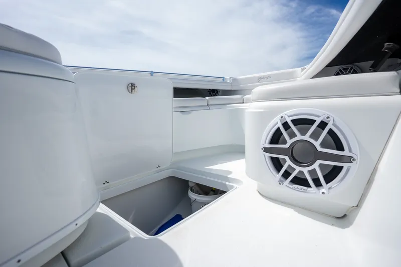 Slide: The Image of 2021 Yellowfin 36 Offshore boat interior with speaker and storage compartments. - 38