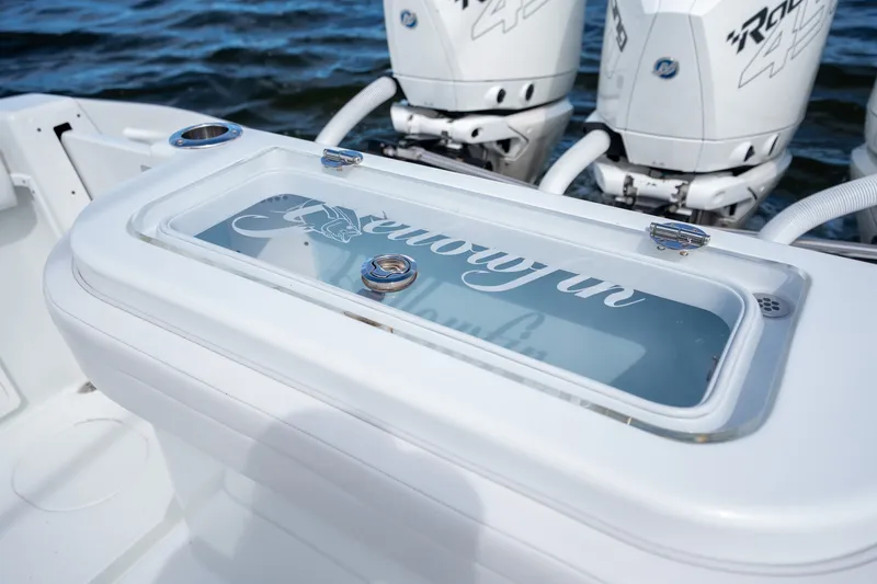 Slide: The Image of 2021 Yellowfin 36 Offshore boat with powerful engines and sleek design on the water. - 18