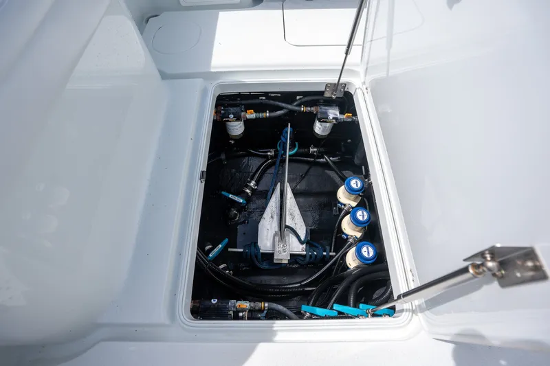 Slide: The Image of 2021 Yellowfin 36 Offshore boat compartment with mechanical components and wiring. - 33