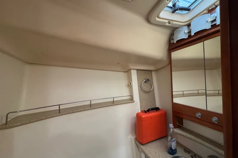 Slide: The Image of Interior of a 2009 Hunter 49 yacht bathroom with mirror and storage. - 36