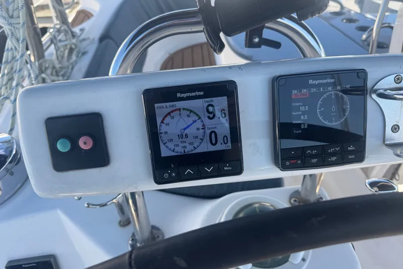 Slide: The Image of Control panel of a 2009 Hunter 49 sailboat with Raymarine displays. - 114