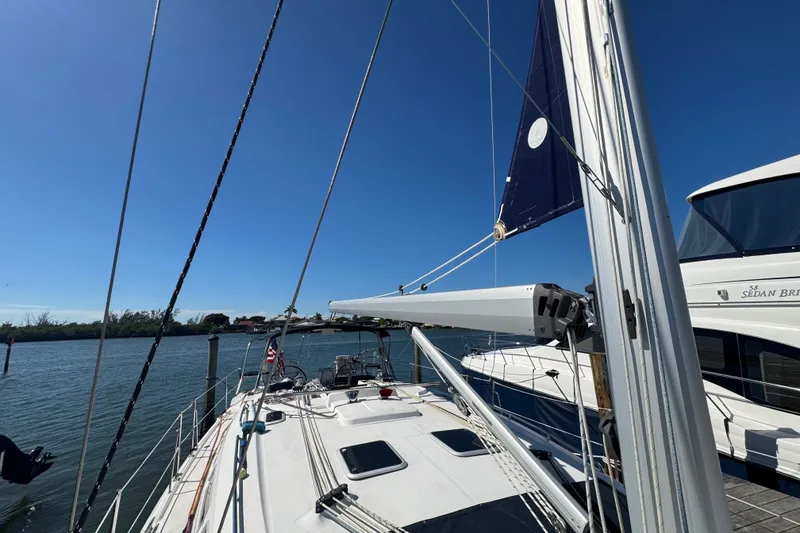 Slide: The Image of Sailboat docked at marina, Hunter 49 model, 2009, with clear blue sky. - 99