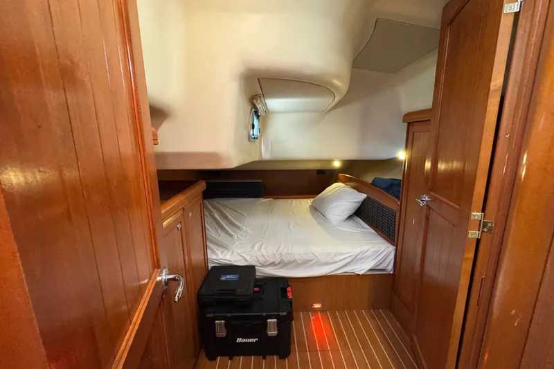 Slide: The Image of Cozy cabin interior of 2009 Hunter 49 yacht with wooden finish and comfortable bed. - 44