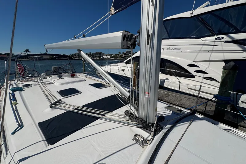 Slide: The Image of Sailboat deck view of 2009 Hunter 49, docked beside another yacht. - 97