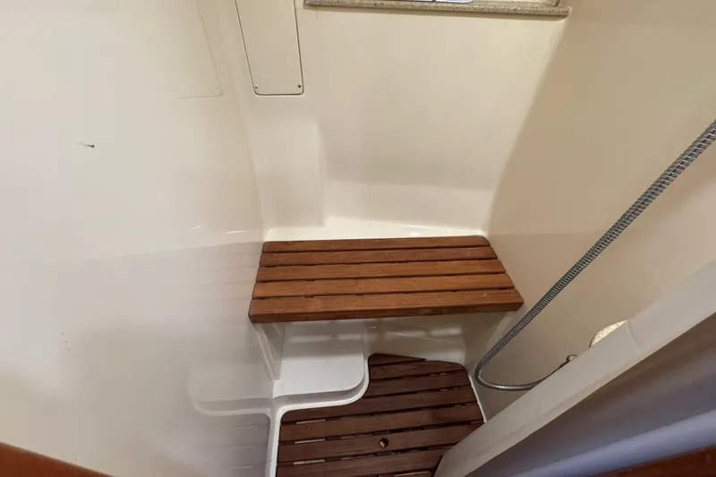 Slide: The Image of Wooden bench and floor in 2009 Hunter 49 yacht shower area. - 30