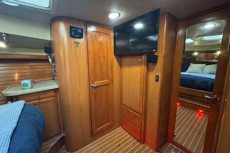 Slide: The Image of Luxurious interior of a 2009 Hunter 49 yacht with wood paneling and modern amenities. - 35