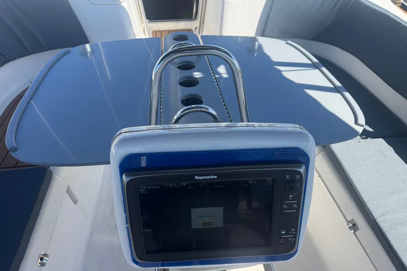 Slide: The Image of Cockpit of 2009 Hunter 49 yacht with Raymarine navigation system and seating area. - 116