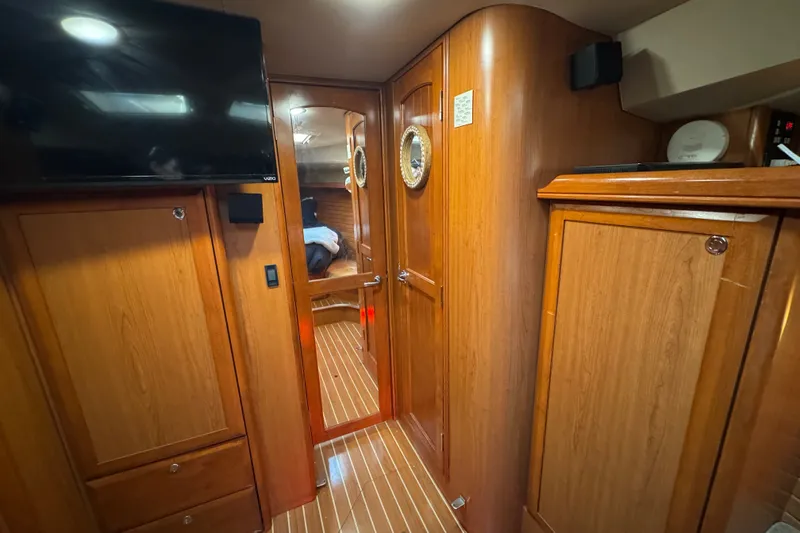 Slide: The Image of Interior of 2009 Hunter 49 yacht with wooden cabinetry and modern amenities. - 38
