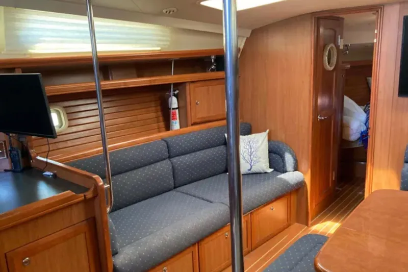 Slide: The Image of Interior of 2009 Hunter 49 yacht with cozy seating and wooden finishes. - 14