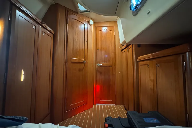 Slide: The Image of Interior of a 2009 Hunter 49 yacht with wooden cabinetry and flooring. - 46