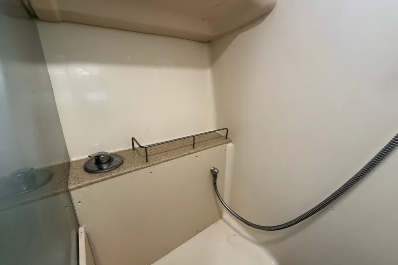 Slide: The Image of Shower area in 2009 Hunter 49 yacht with beige walls and flexible hose. - 53