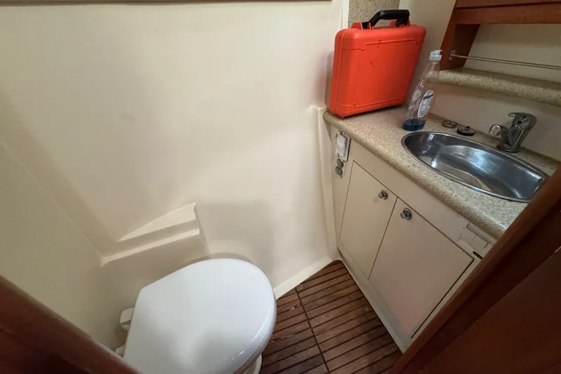 Slide: The Image of Compact bathroom in 2009 Hunter 49 yacht with sink, toilet, and storage. - 37