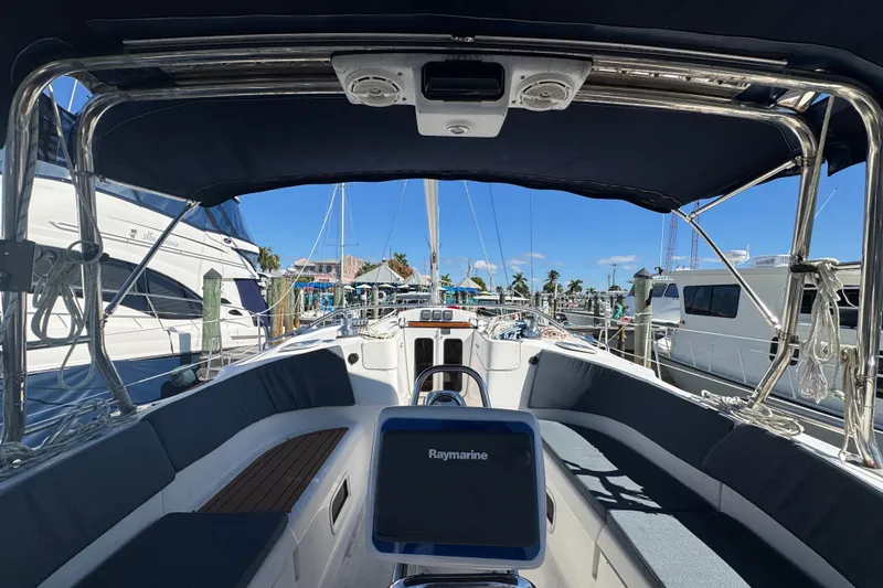 Slide: The Image of Interior view of a 2009 Hunter 49 sailboat docked at a marina under clear blue skies. - 85
