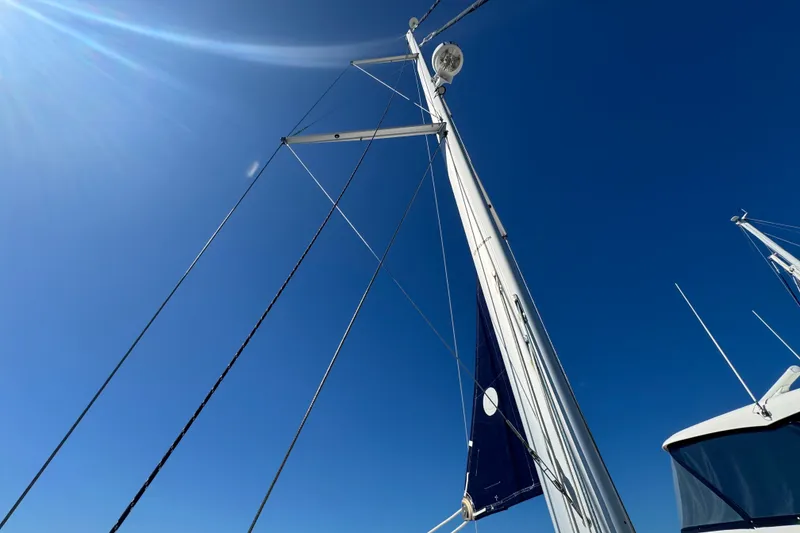 Slide: The Image of Sailboat mast of 2009 Hunter 49 against clear blue sky. - 98