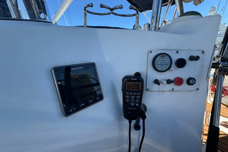 Slide: The Image of Control panel of a 2009 Hunter 49 sailboat with navigation and communication equipment. - 112