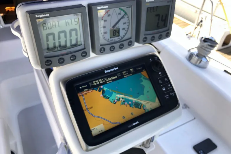 Slide: The Image of Cockpit navigation instruments on a 2000 Catalina 380 sailboat, featuring Raytheon displays and GPS. - 20
