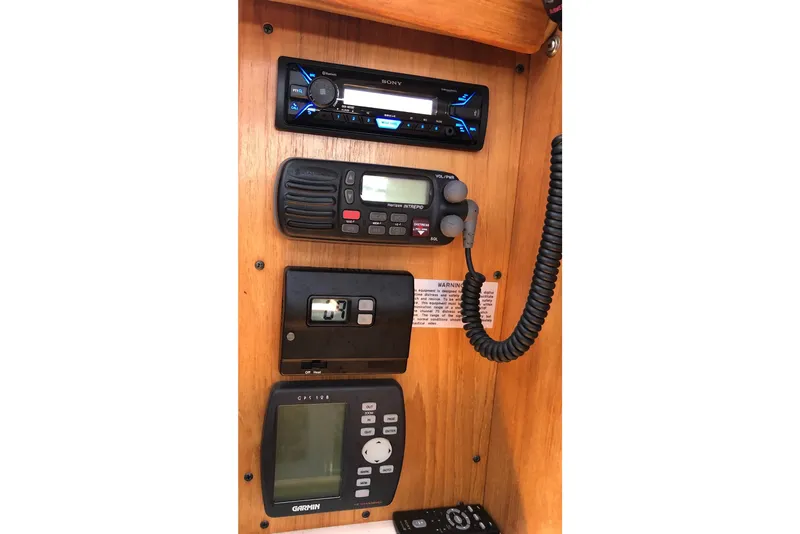 Slide: The Image of Control panel of a 2000 Catalina 380 sailboat with radio and navigation equipment. - 7