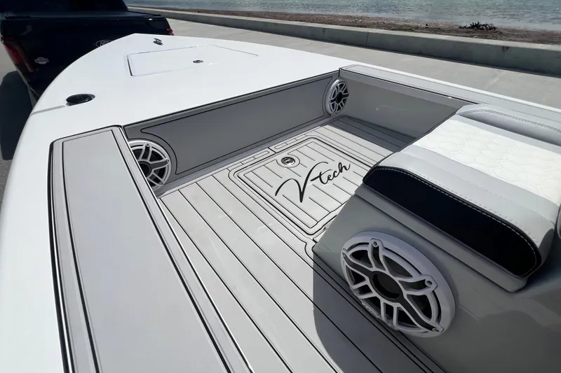 Slide: The Image of 2025 Vtech 18 boat interior with sleek design, featuring speakers and comfortable seating. - 60