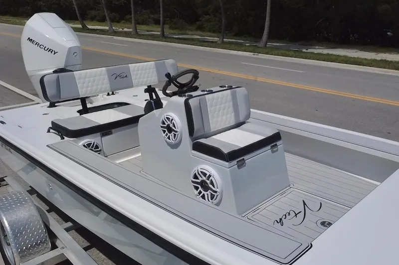 Slide: The Image of 2025 Vtech 18 boat with Mercury engine, featuring sleek seating and modern design. - 28