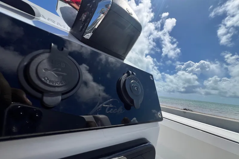 Slide: The Image of Charging ports on a Vtech 18, 2025 model, with ocean view and blue sky. - 77