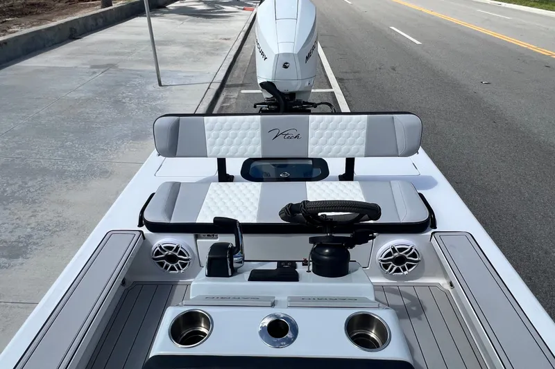 Slide: The Image of Modern Vtech 18 boat interior with sleek seating and Mercury engine, 2025 model. - 37