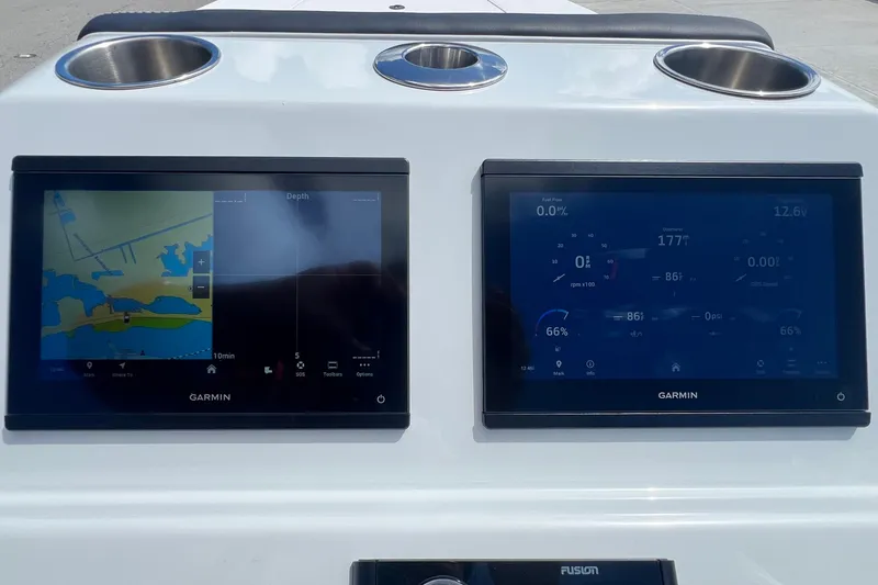 Slide: The Image of Two Garmin marine displays on a Vtech 18 model, 2025 dashboard. - 54