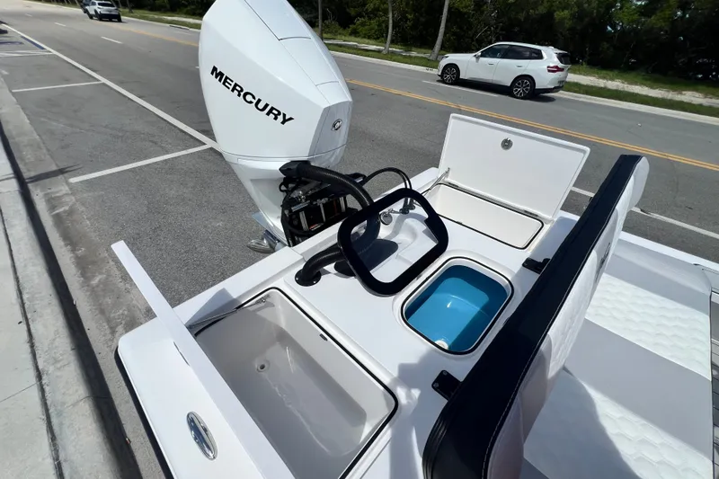 Slide: The Image of Boat with Mercury engine, Vtech 18 model, 2025, featuring storage compartments and seating. - 45