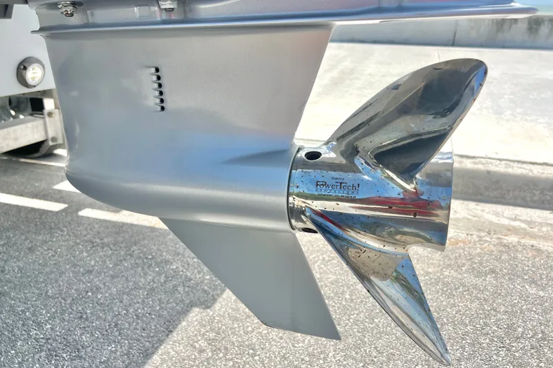 Slide: The Image of Shiny stainless steel boat propeller on a Custom Vtech 18 Flats, 2025 model. - 13