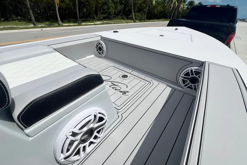 Slide: The Image of Interior of 2025 Vtech 18 boat with sleek seating and modern speaker system. - 61
