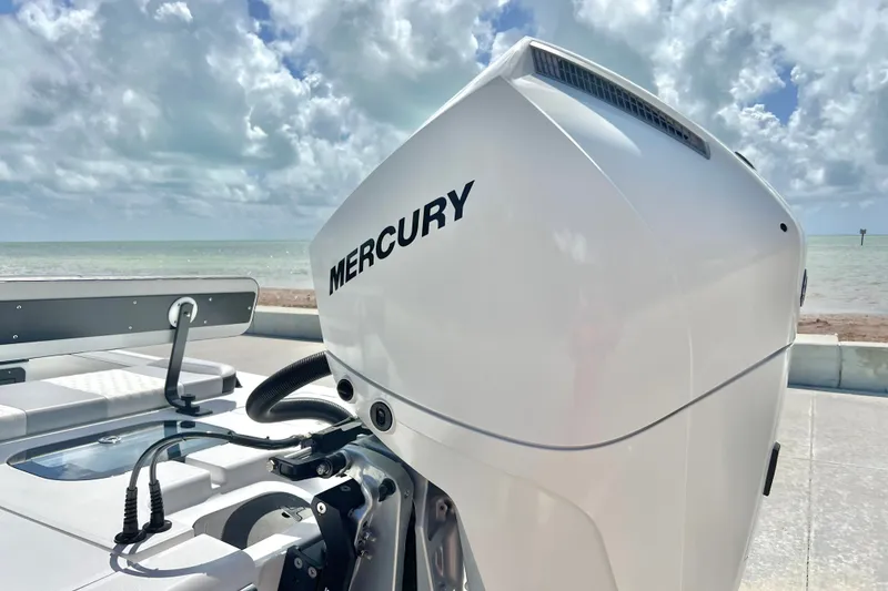 Slide: The Image of Outboard motor on Custom Vtech 18 Flats boat, 2025 model, by the sea. - 12