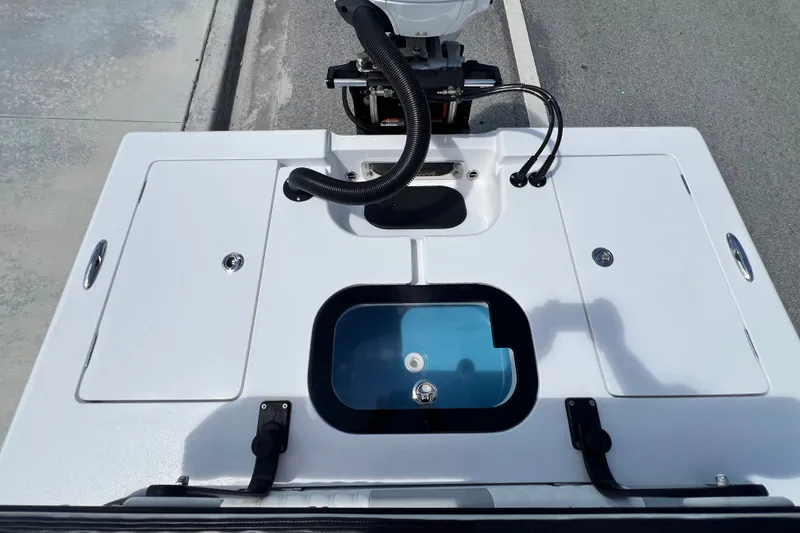 Slide: The Image of Vtech 18 boat deck with storage compartments and motor, 2025 model. - 43