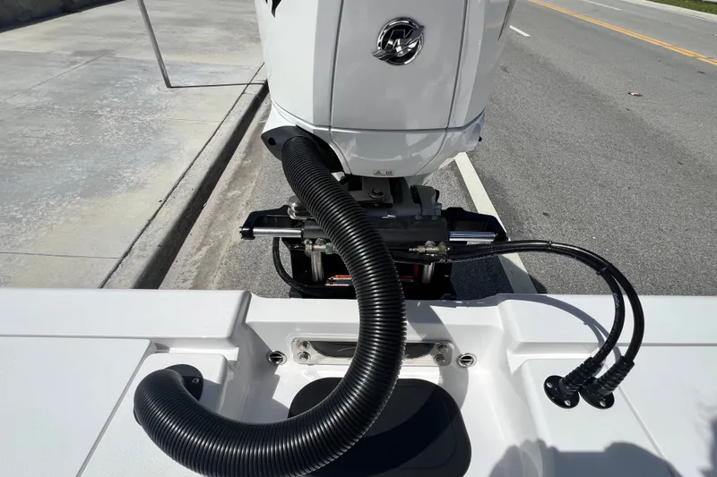 Slide: The Image of Boat engine setup on a Vtech 18, 2025 model, with visible cables and hoses. - 47
