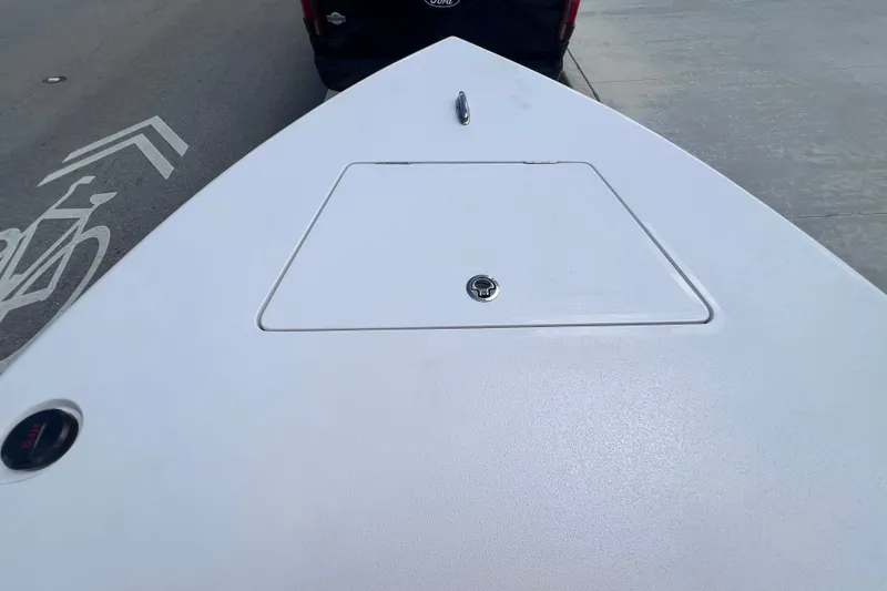 Slide: The Image of Bow of a Vtech 18 boat, 2025 model, with a storage hatch and cleat. - 65