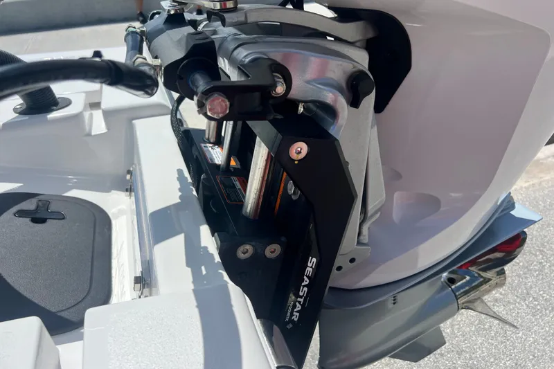 Slide: The Image of Close-up of a Vtech 18 boat engine mount, featuring SeaStar hydraulic components, 2025 model. - 79