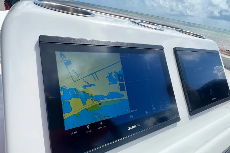 Slide: The Image of Garmin navigation screens on a Vtech 18 boat, 2025 model, displaying a nautical map. - 56